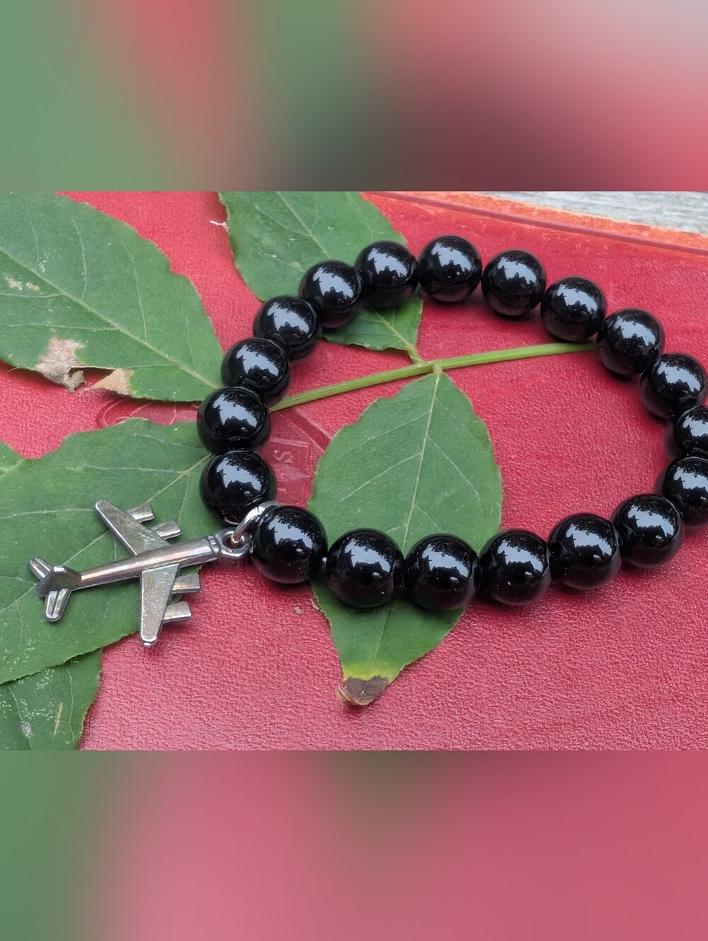 Black Beaded Bracelet with Airplane Charm